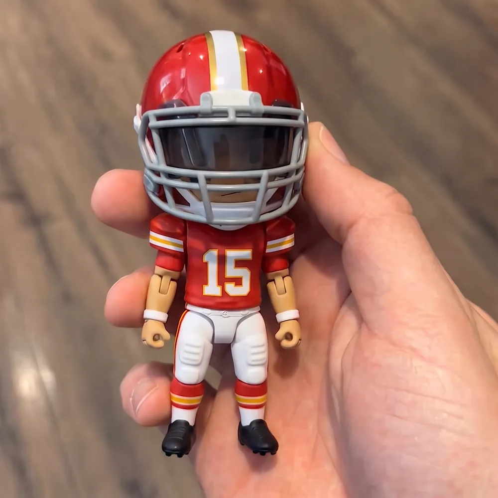 Kansas City ยท #15 mini football player figure standing in a palm